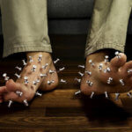 Pins in feet showing peripheral neuropathy pain